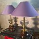 A pair of vintage table lamps featuring a turned wooden base, accessories...