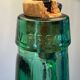 Lampe Dame-jeanne vintage en verre vert et rotin