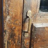 Glass-fronted entrance cabinet in Burmese teak