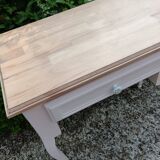 Console with 2 drawers, pink, wooden top.