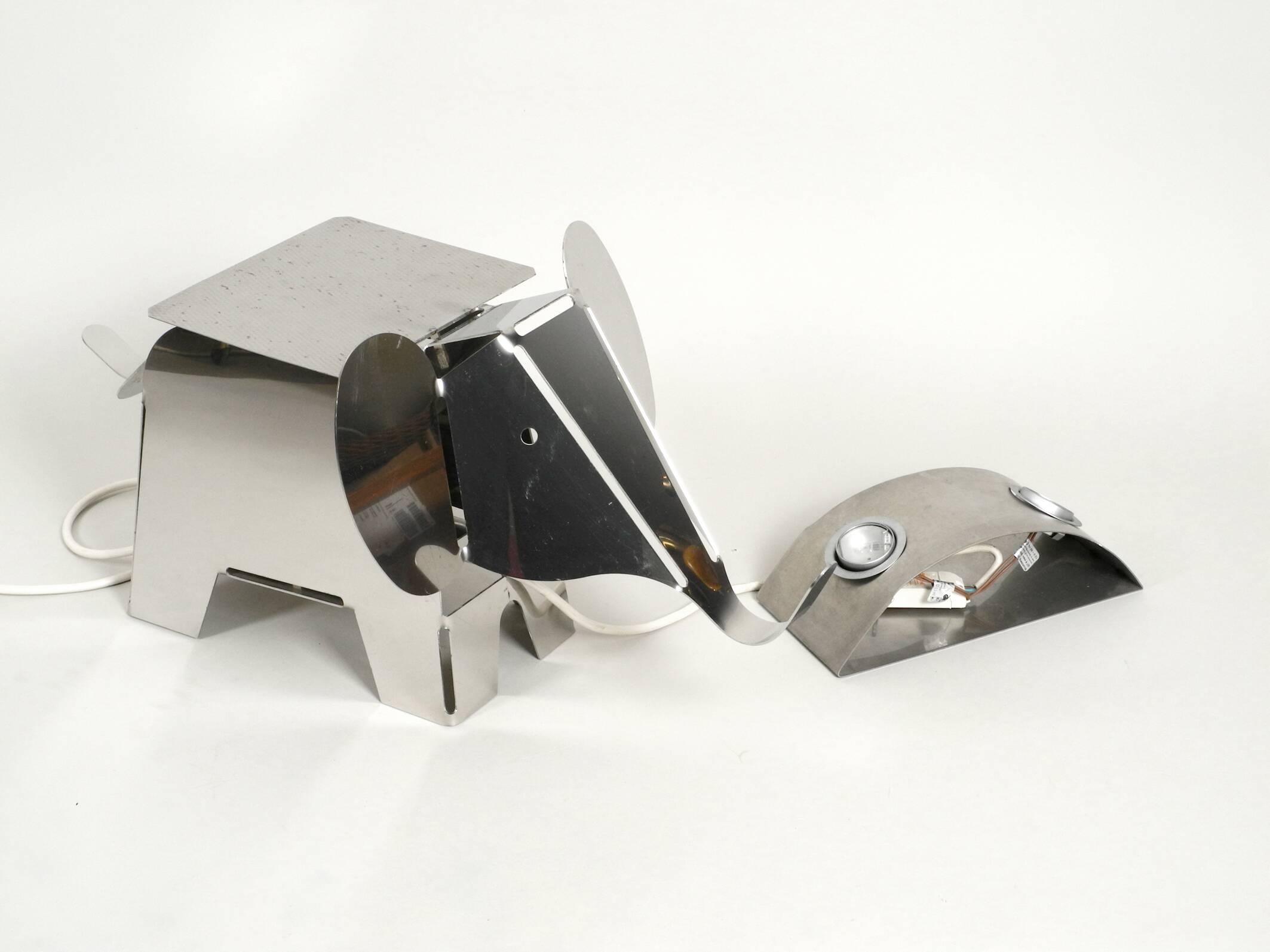 80s heavy metal chrome elephant floor lamp as side table Postmodern design