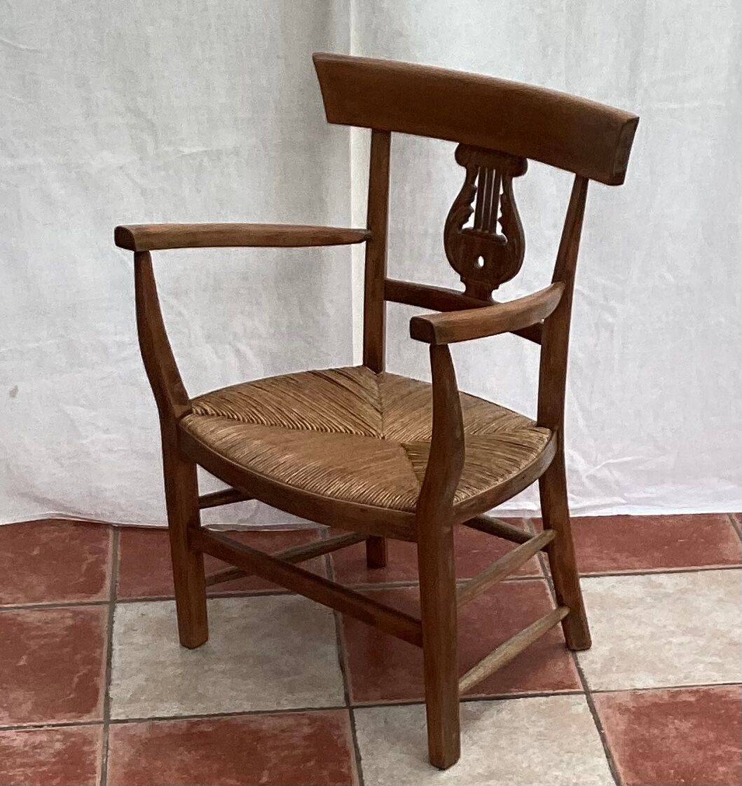 Light wood armchair seated in vintage straw dimension: height -78cm- width -54cm-