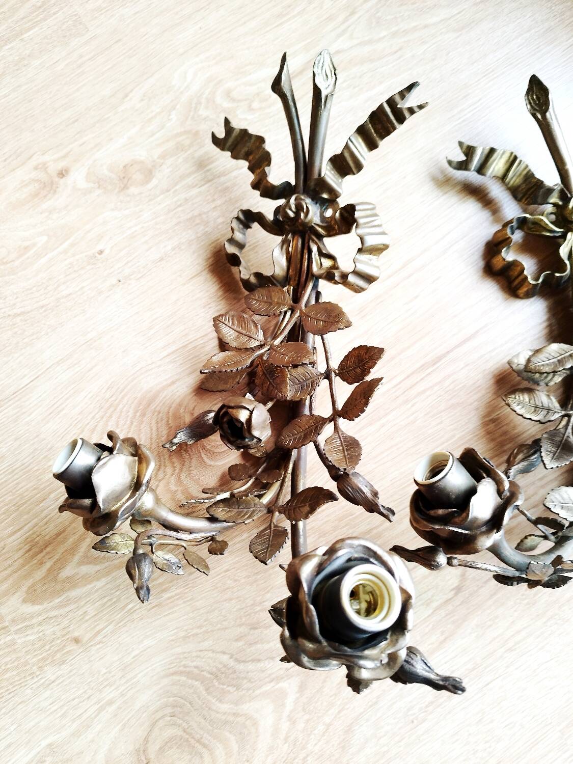 Pair of bronze and gilded metal wall sconces in the Louis XVI style.