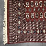 Handwoven red Boukhara oriental rug, 1960s