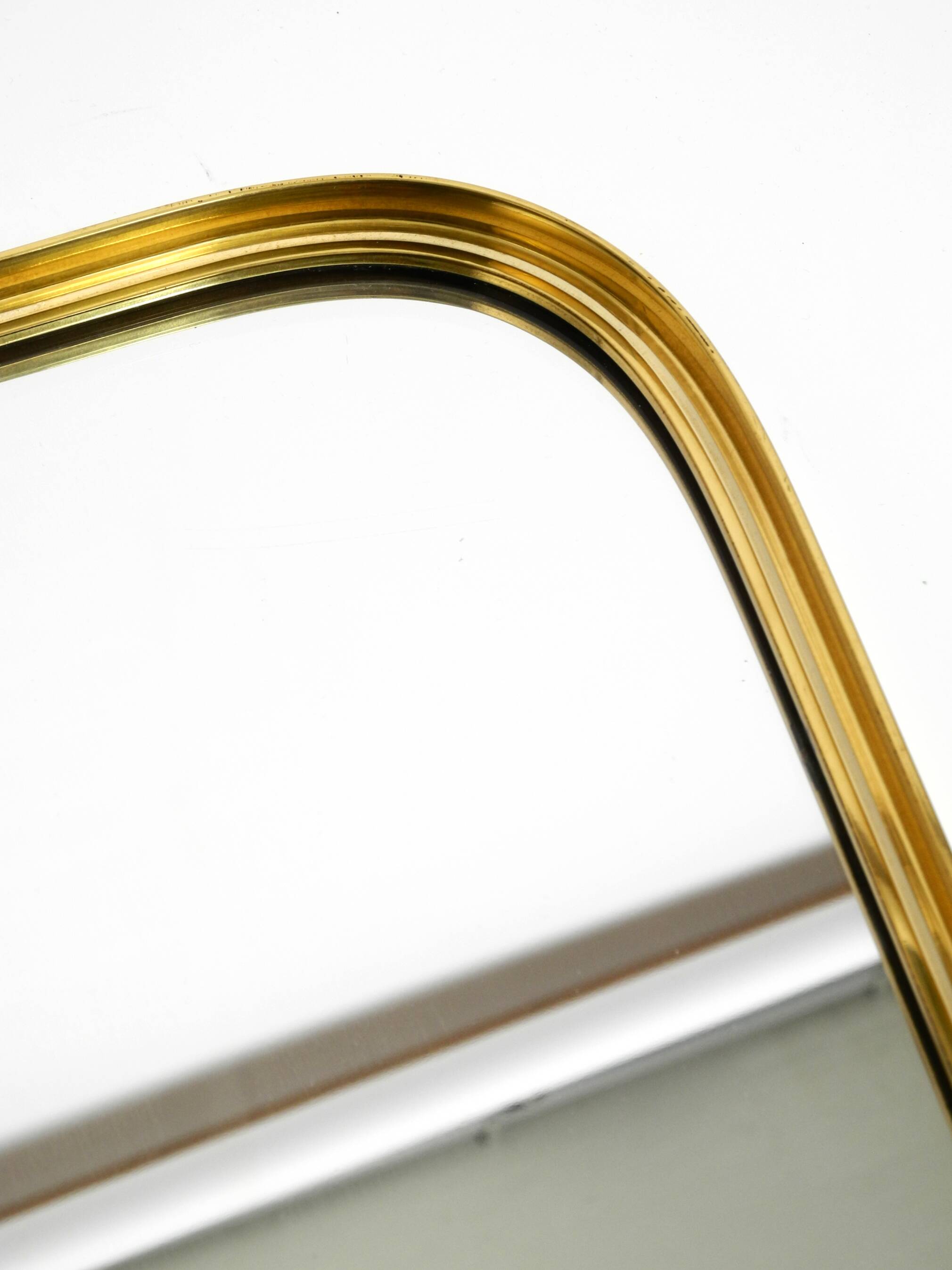 Small solid Mid Century brass wall mirror by Münchener Zierspiegel