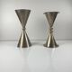 Rare pair of bell and candlestick in the shape of an hourglass, postmodern style - Memphis in metal, 1980.