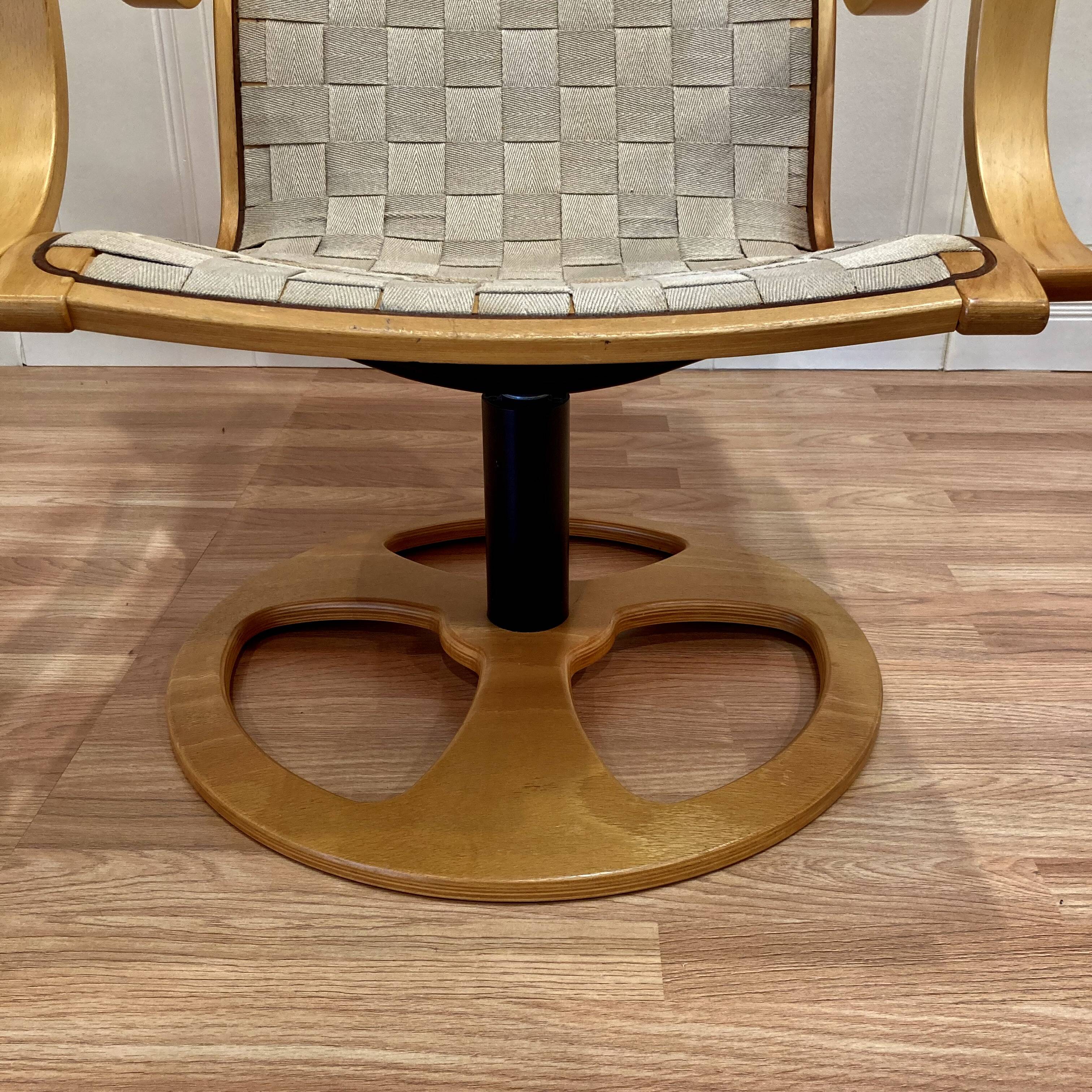 Swivel armchair and its ottoman in 1960s Scandinavian design.