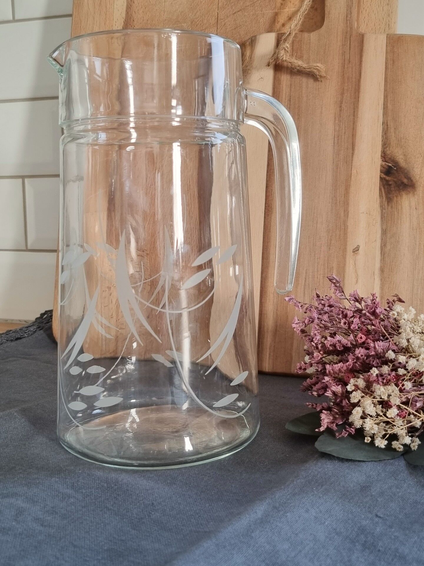 Engraved glass pitcher