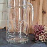 Engraved glass pitcher