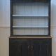 Black patina two-body buffet, white interior, 1950s.