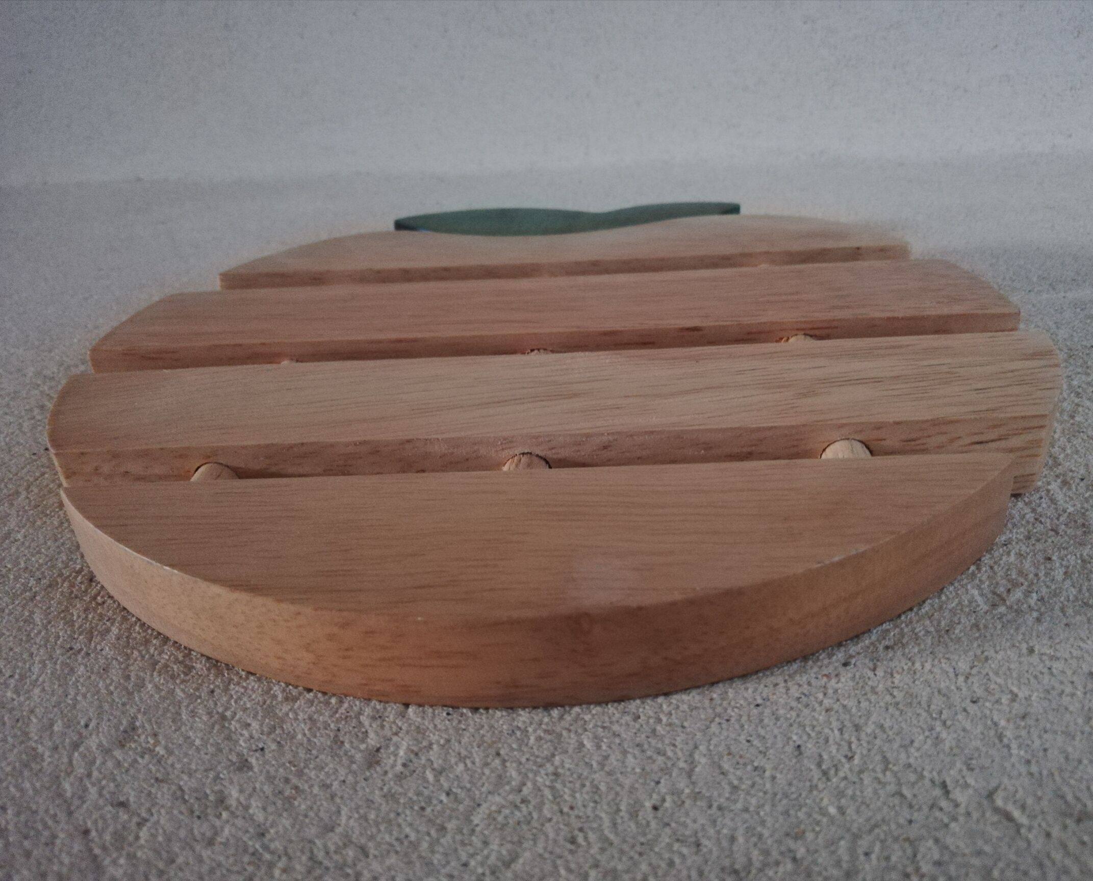 Wooden underside of apple shape