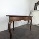 Louis XV corner table in walnut with curved legs.