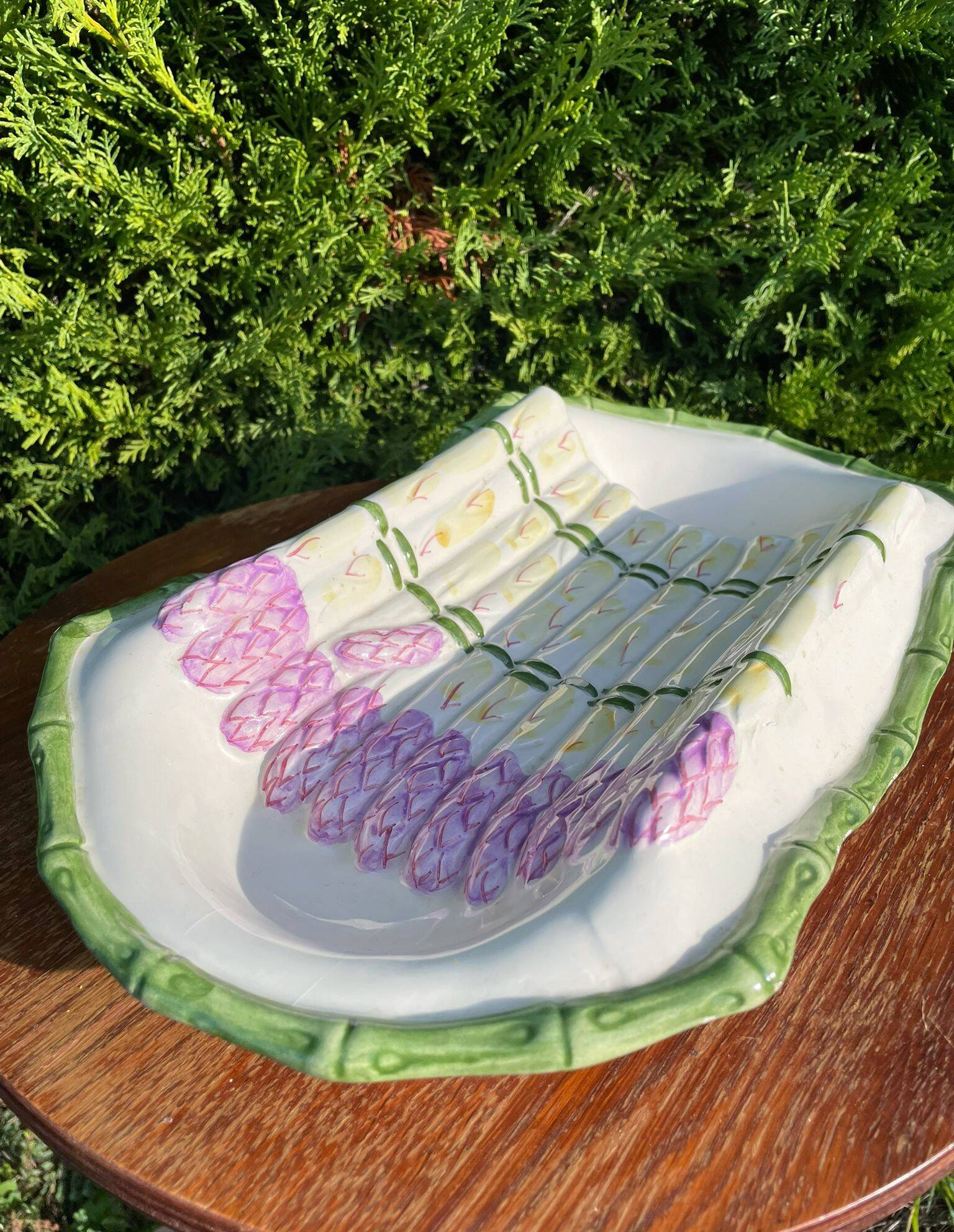 Plate of asparagus with a sauce.