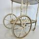 Italian oval rolling table in brass and lacquered wood.