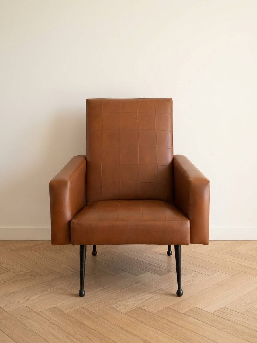 Vintage 1950s brown faux leather armchair