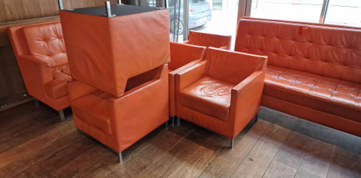 14 armchairs and 4 vintage orange leather benches