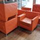 14 armchairs and 4 vintage orange leather benches