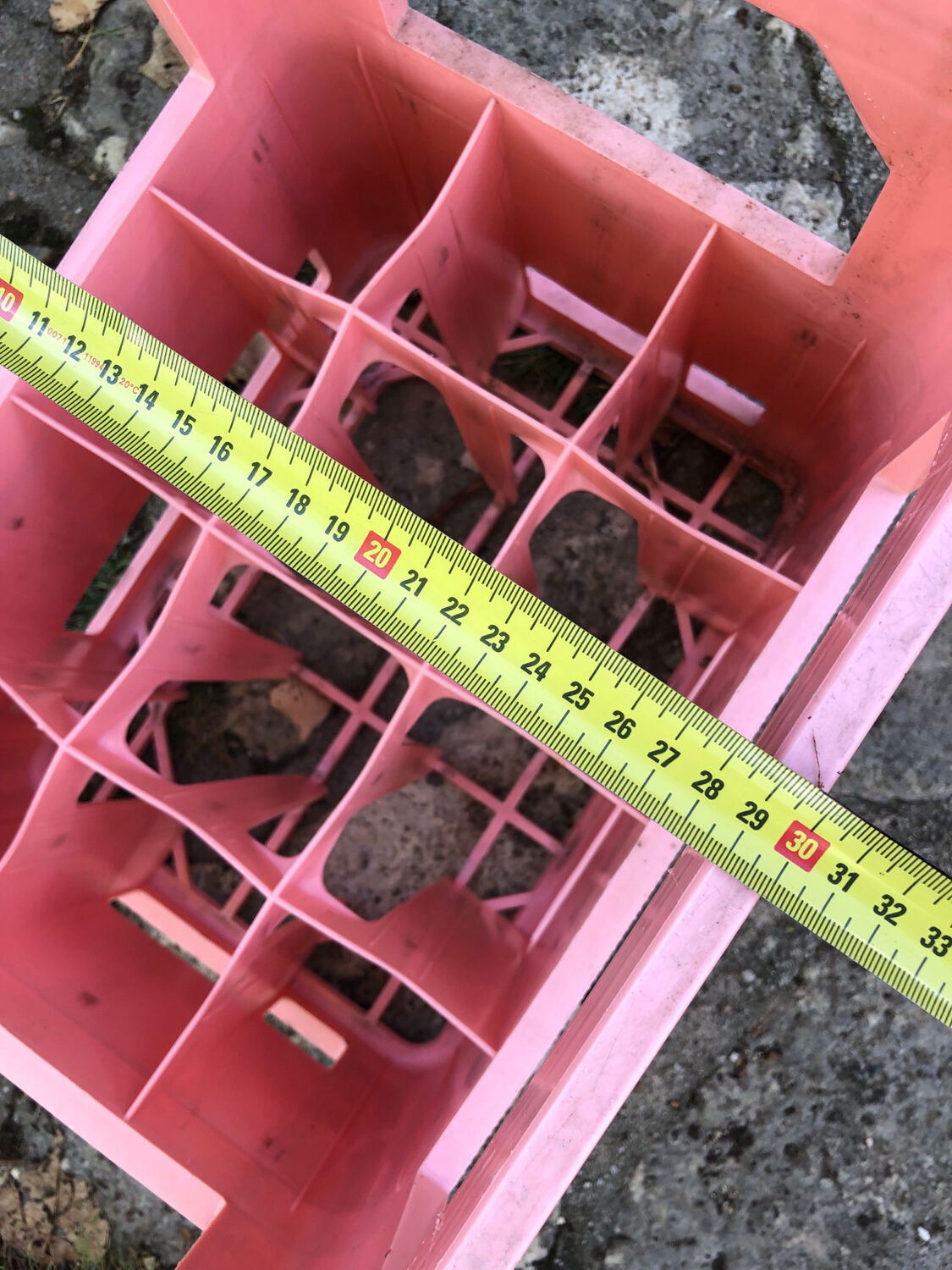 Evian bottle holder in pink plastic