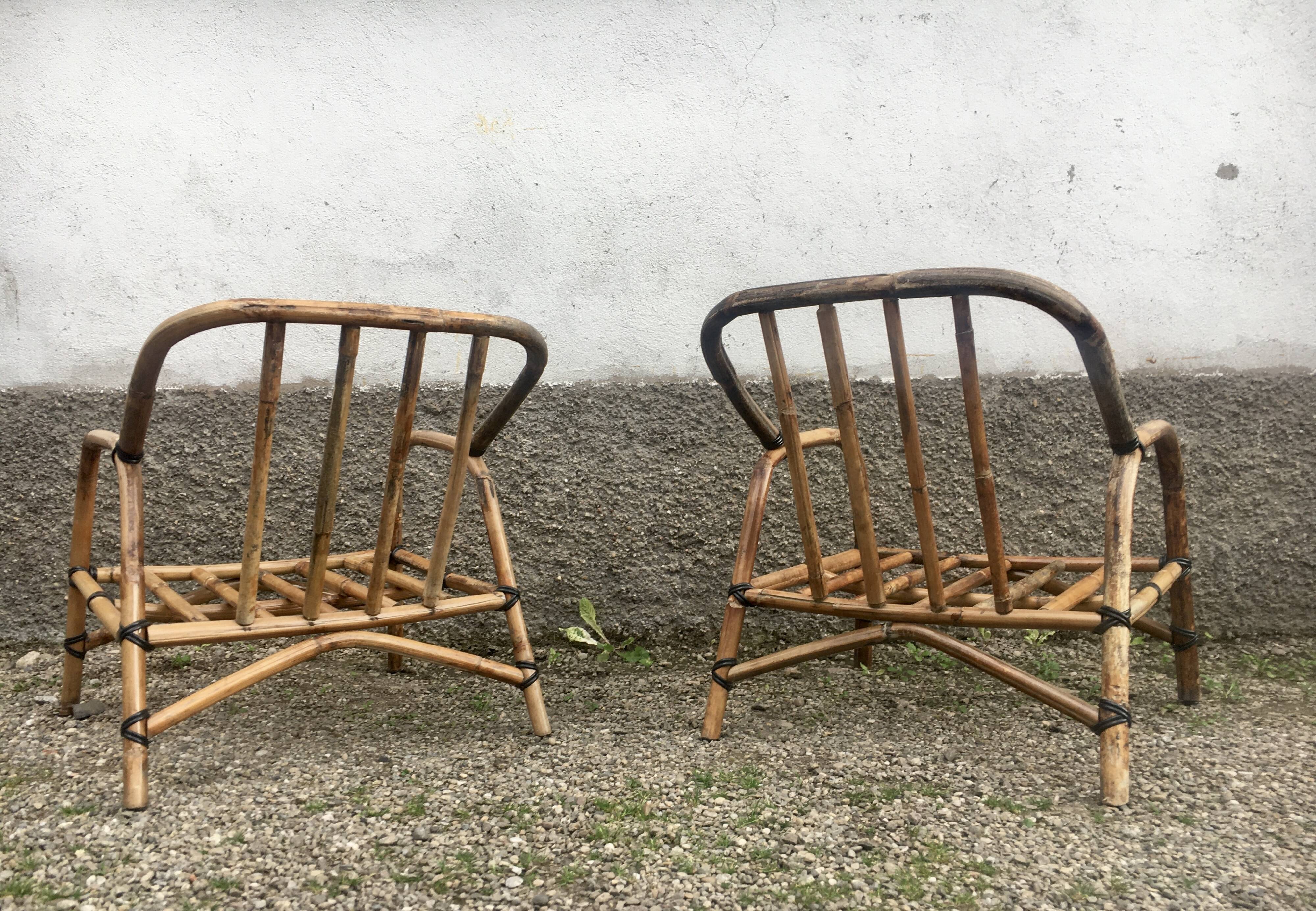Pair of rattan armchairs and vintage oval table