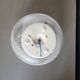 Frosted glass globe ceiling light with spiral patterns.