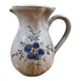 Vintage grey ceramic pitcher with hand-painted blue flower decoration.