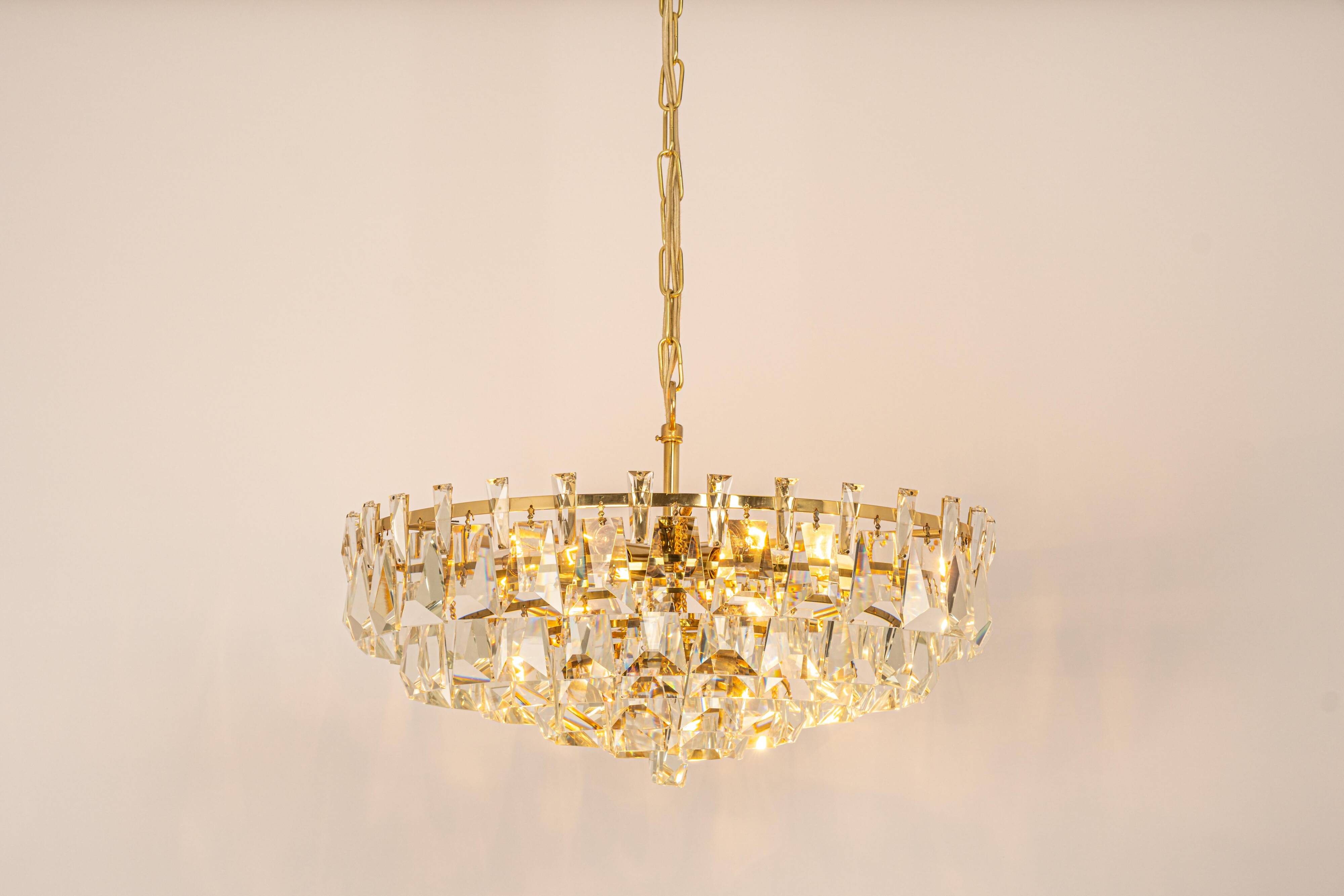 Large chandelier in gilded brass and crystal, by Palwa, Germany, 1970s.
