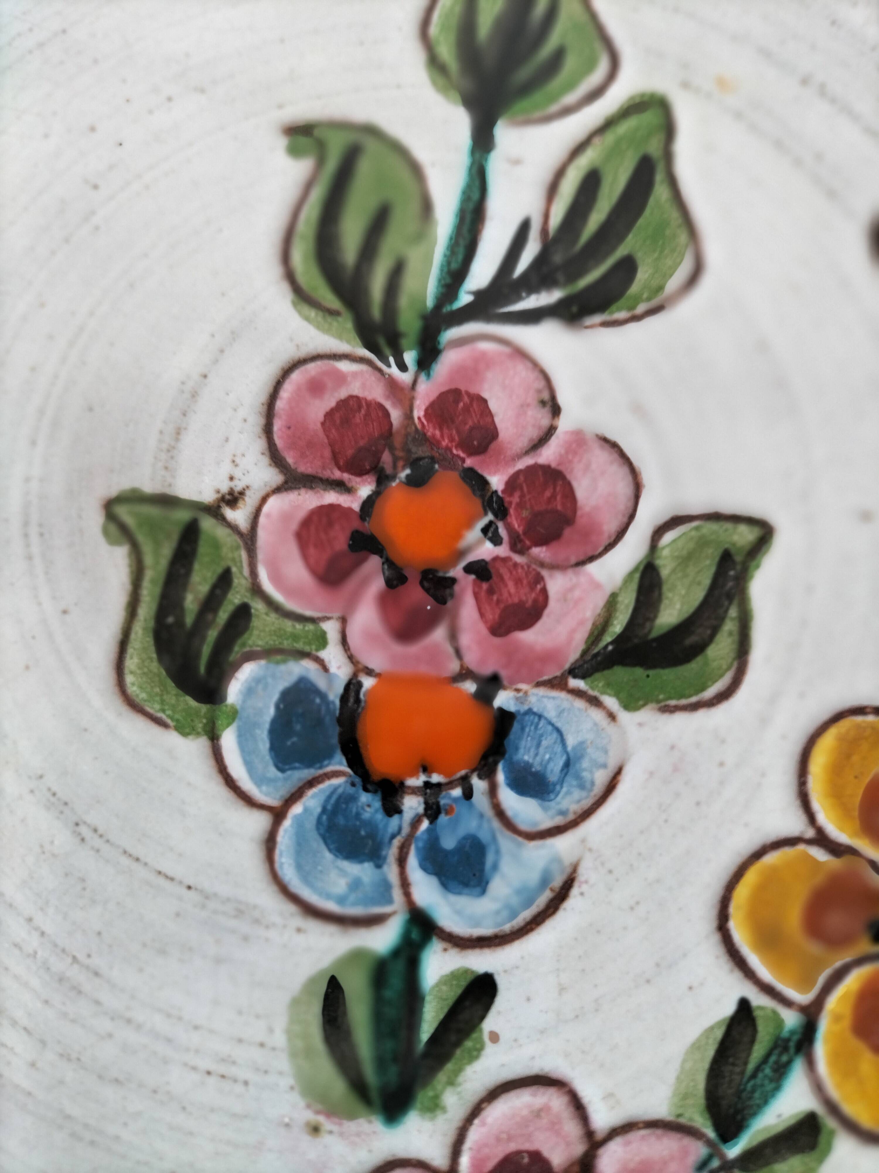 Glazed stoneware plate with floral motif