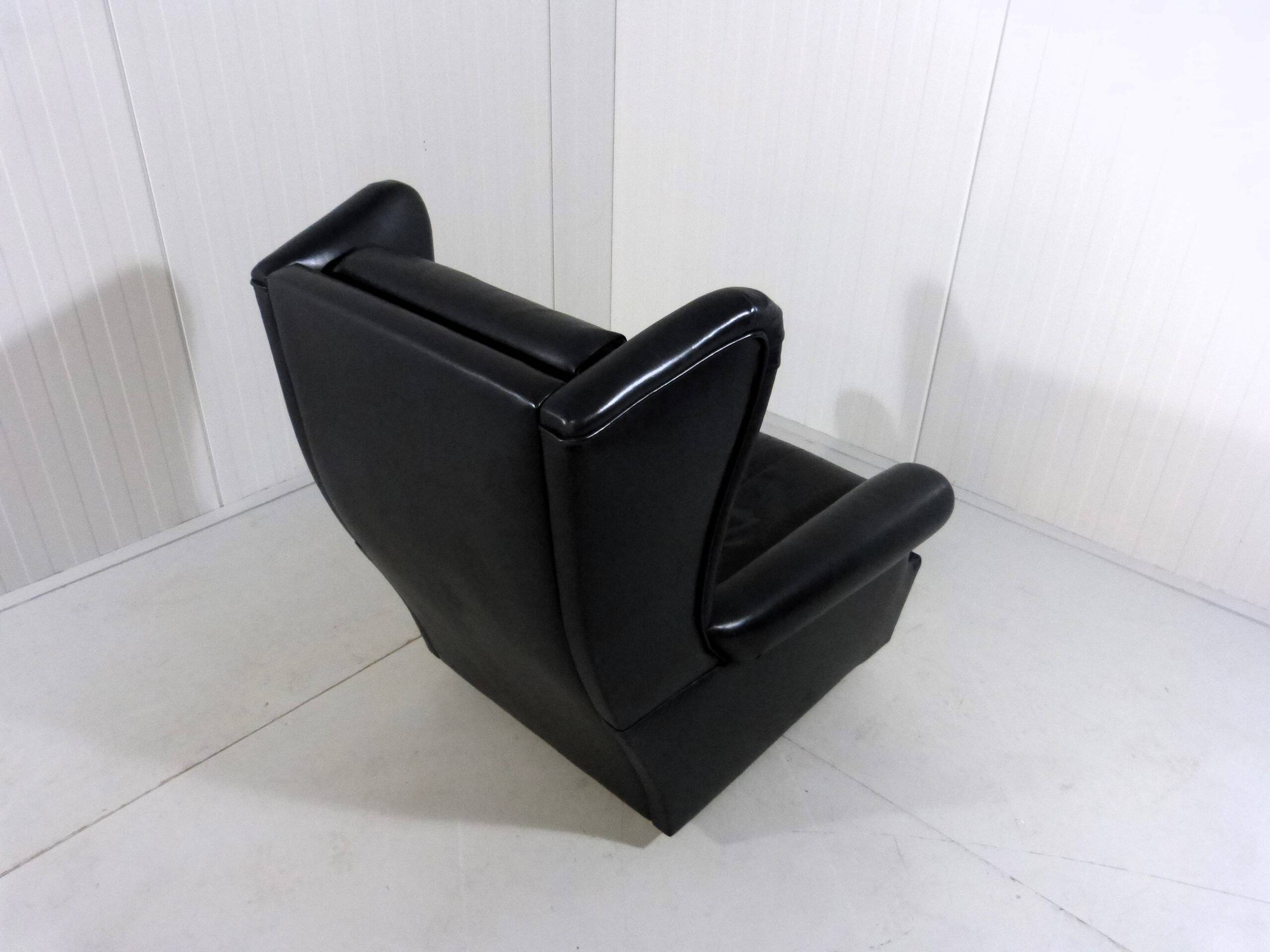 Black leather wingback chair on wheels 1960’s