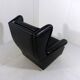 Fauteuil à oreilles en cuir noir sur roulettes années 1960