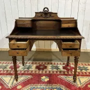 Louis XVI style desk from the late 19th century in walnut with a leather top.