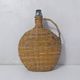 old bottle dressed in rattan vintage pilgrim gourd