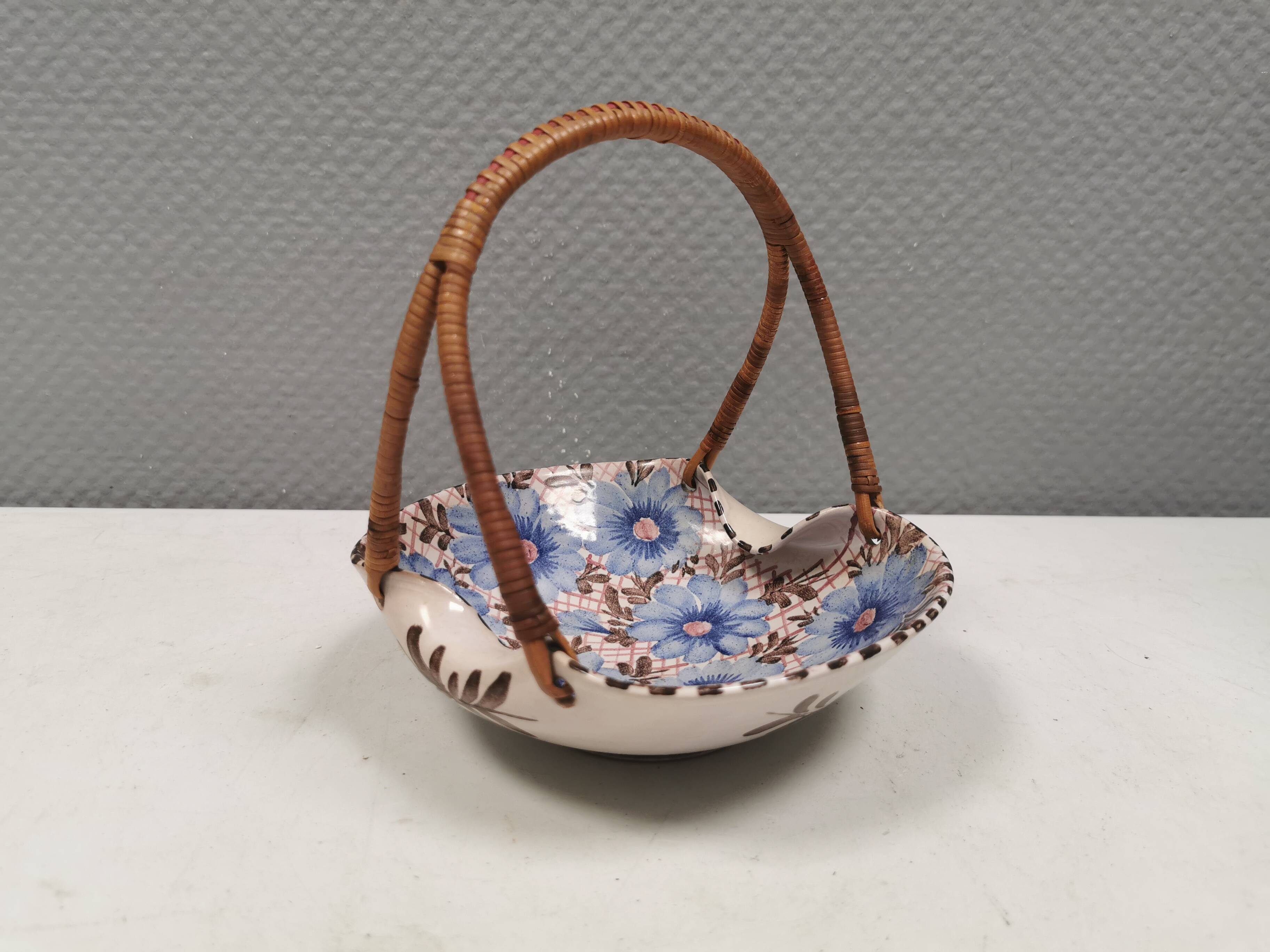Beautiful small painted ceramic basket with woven handle