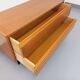 Small vintage Scandinavian sideboard in modernist style made of light oak wood.