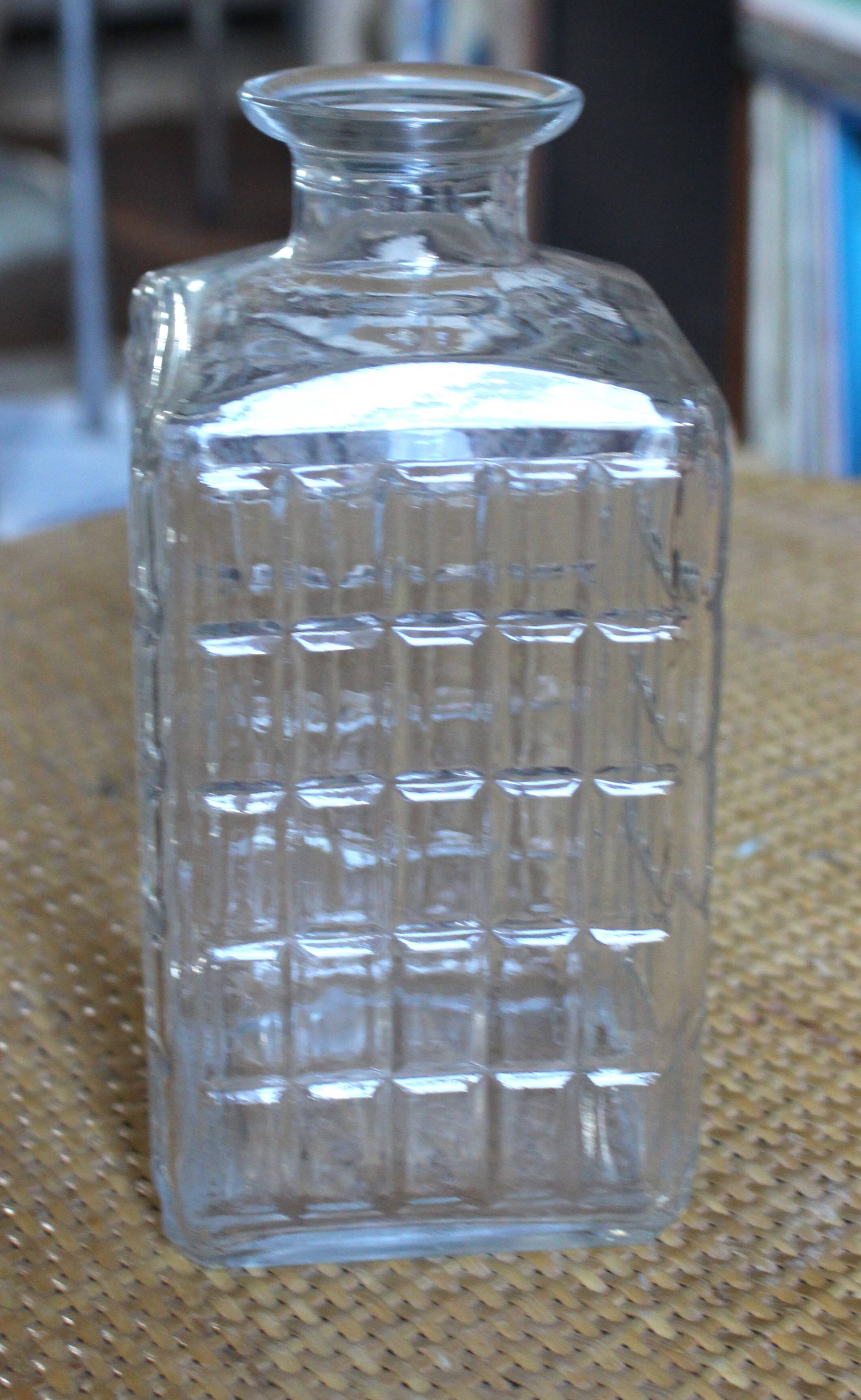 Vintage glass water carafe with rectangular vase.