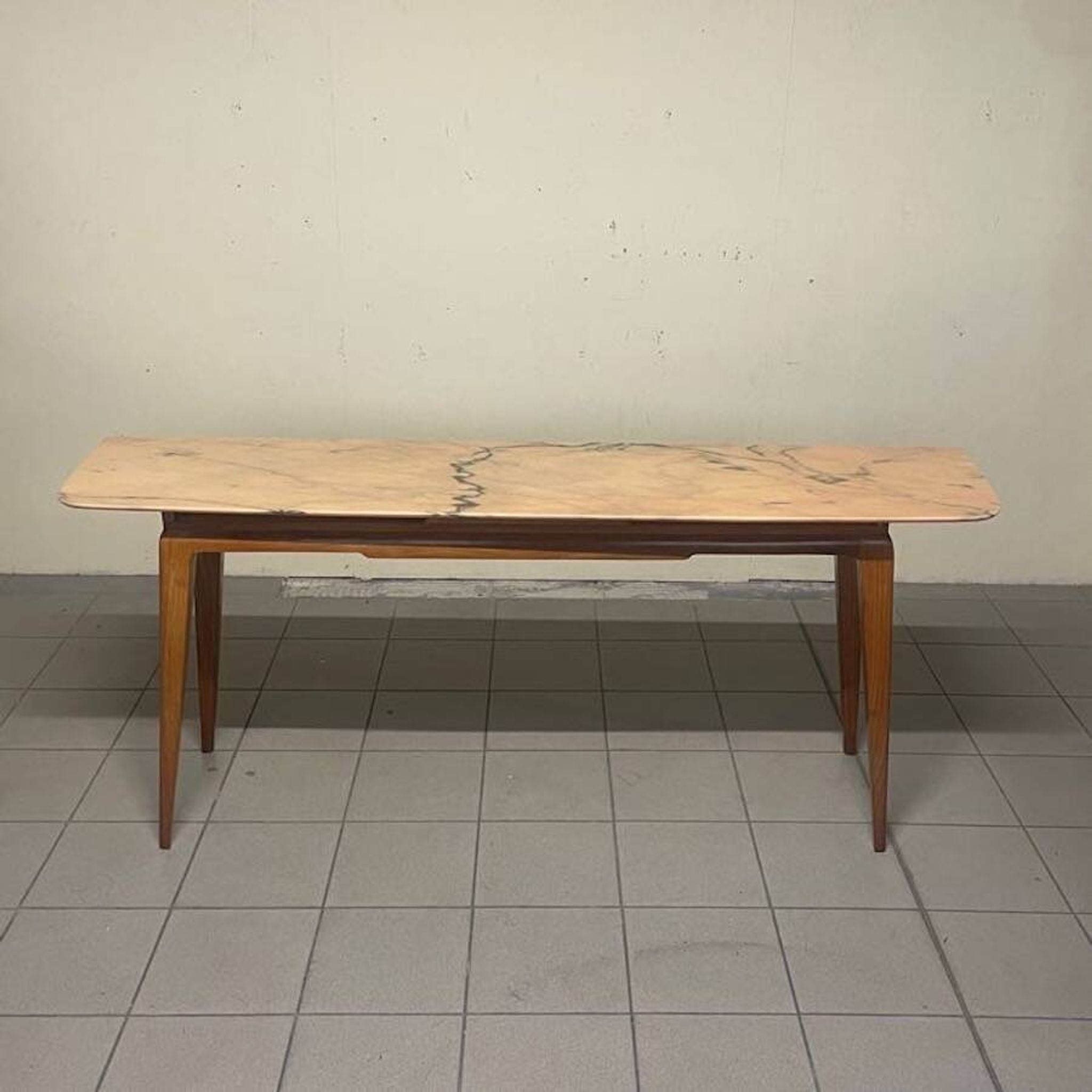 Console from the 1950s with a pink marble top and a cherry wood frame.