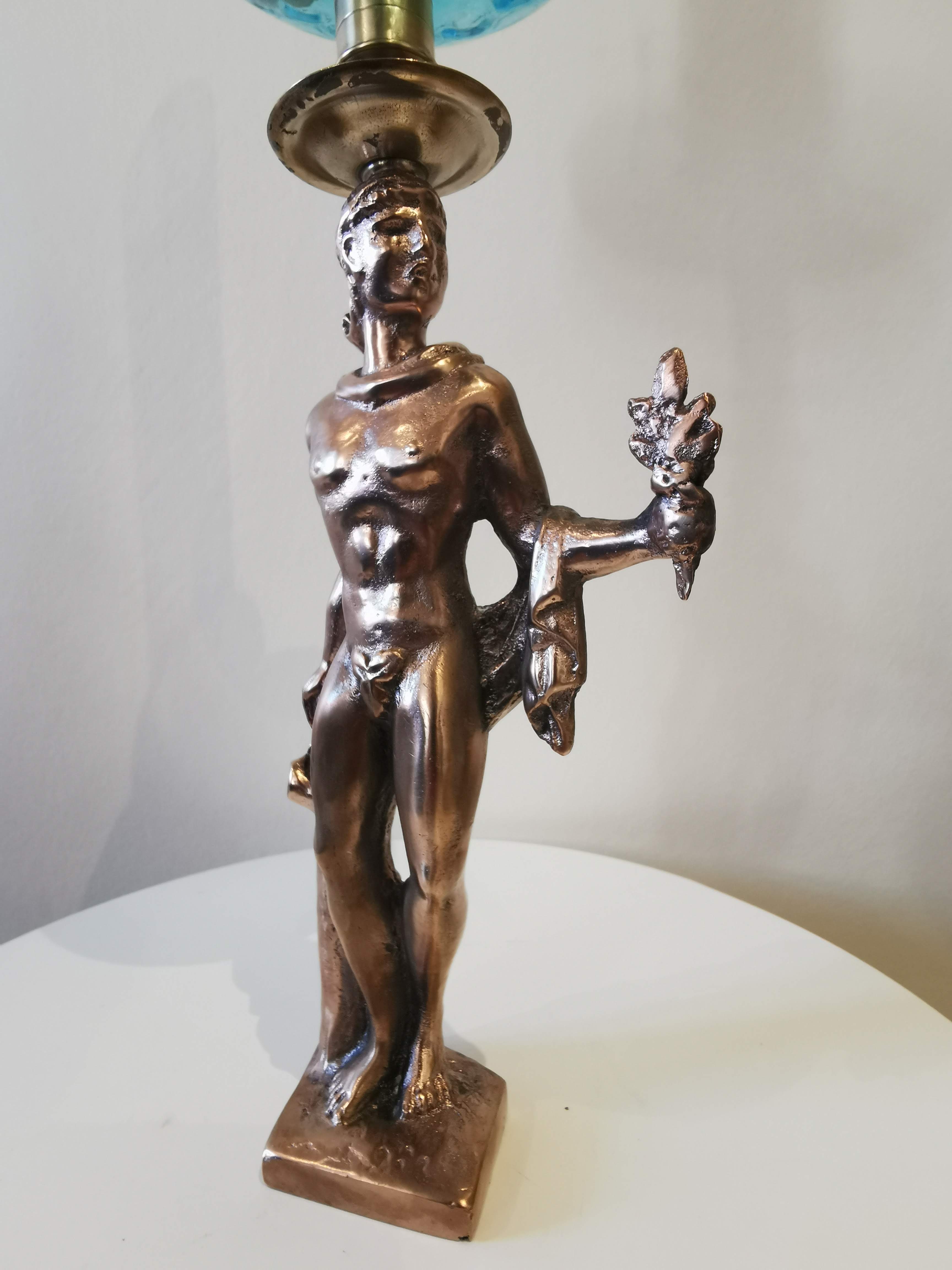 Large kerosene lamp mounted on bronze statue. Late nineteenth century