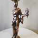 Large kerosene lamp mounted on bronze statue. Late nineteenth century
