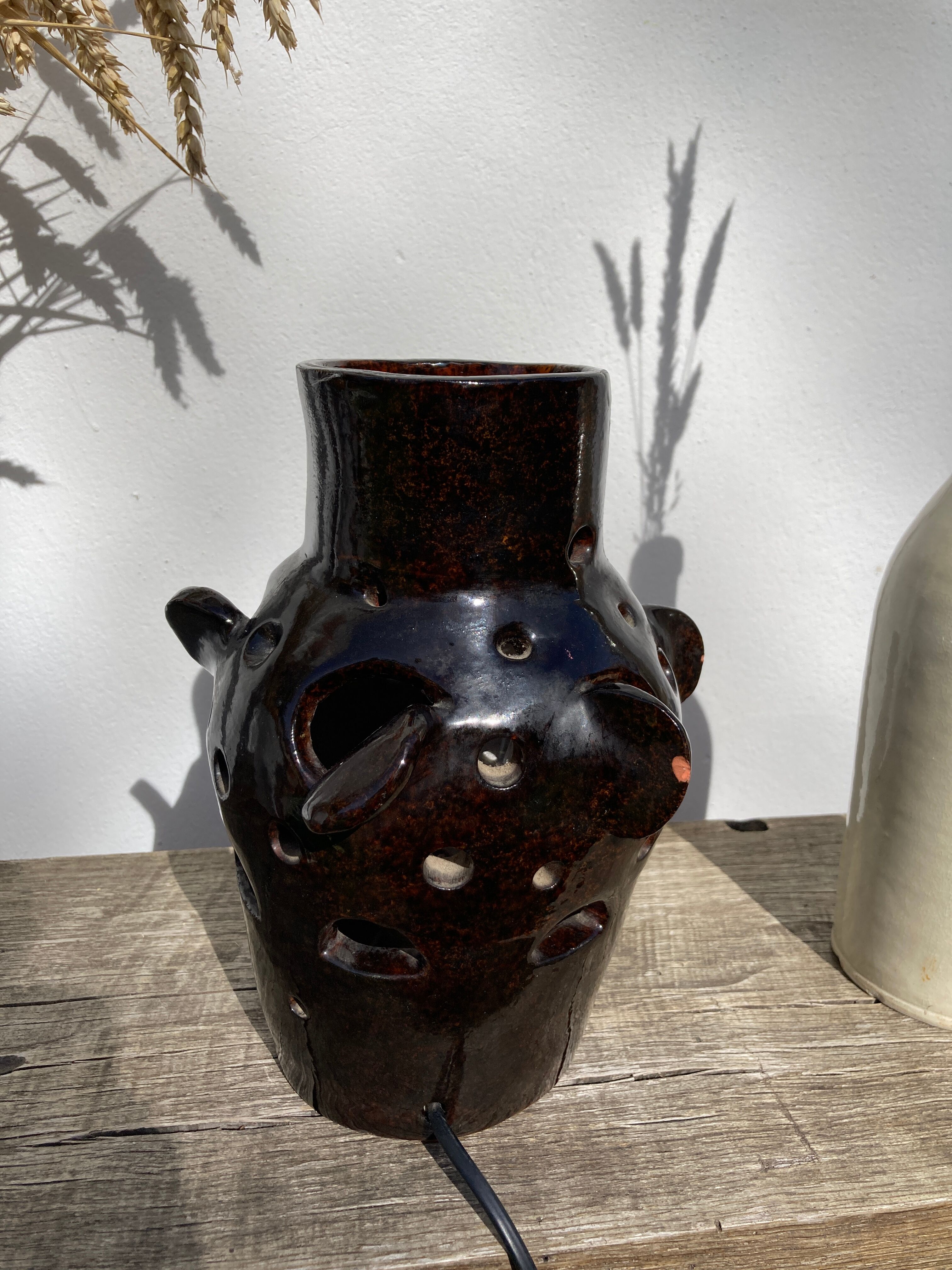 Brutalist lamp in black / brown ceramic openwork 1970