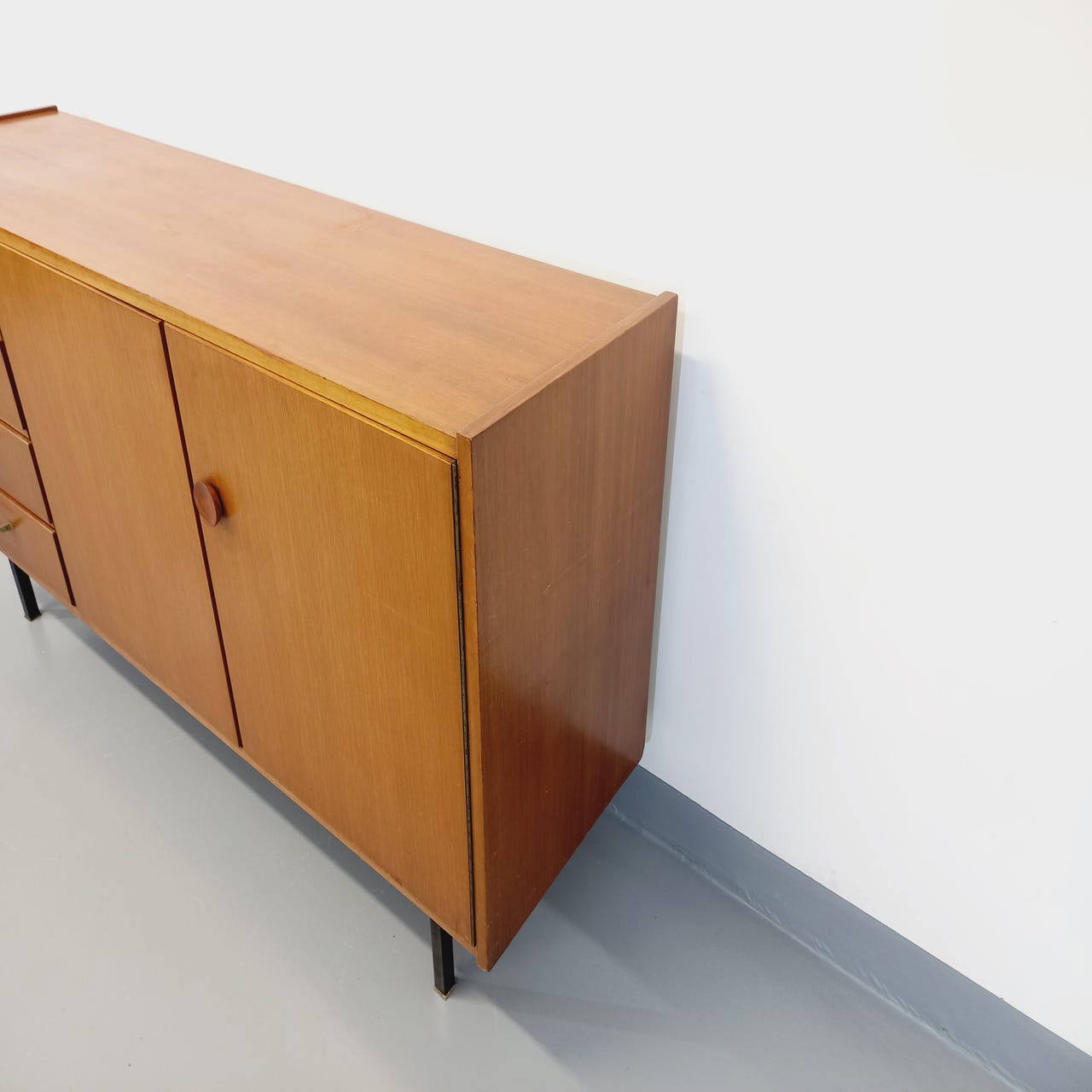 Vintage teak and black metal row from the 60s