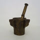 Old apothecary mortar with fins and its bronze pestle