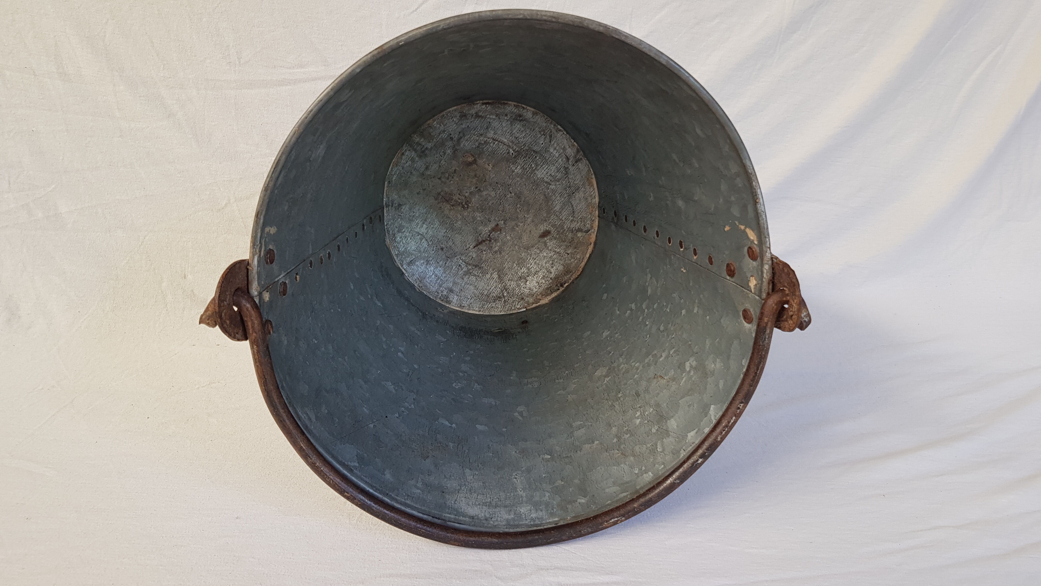 Old bucket with thick zinc handle