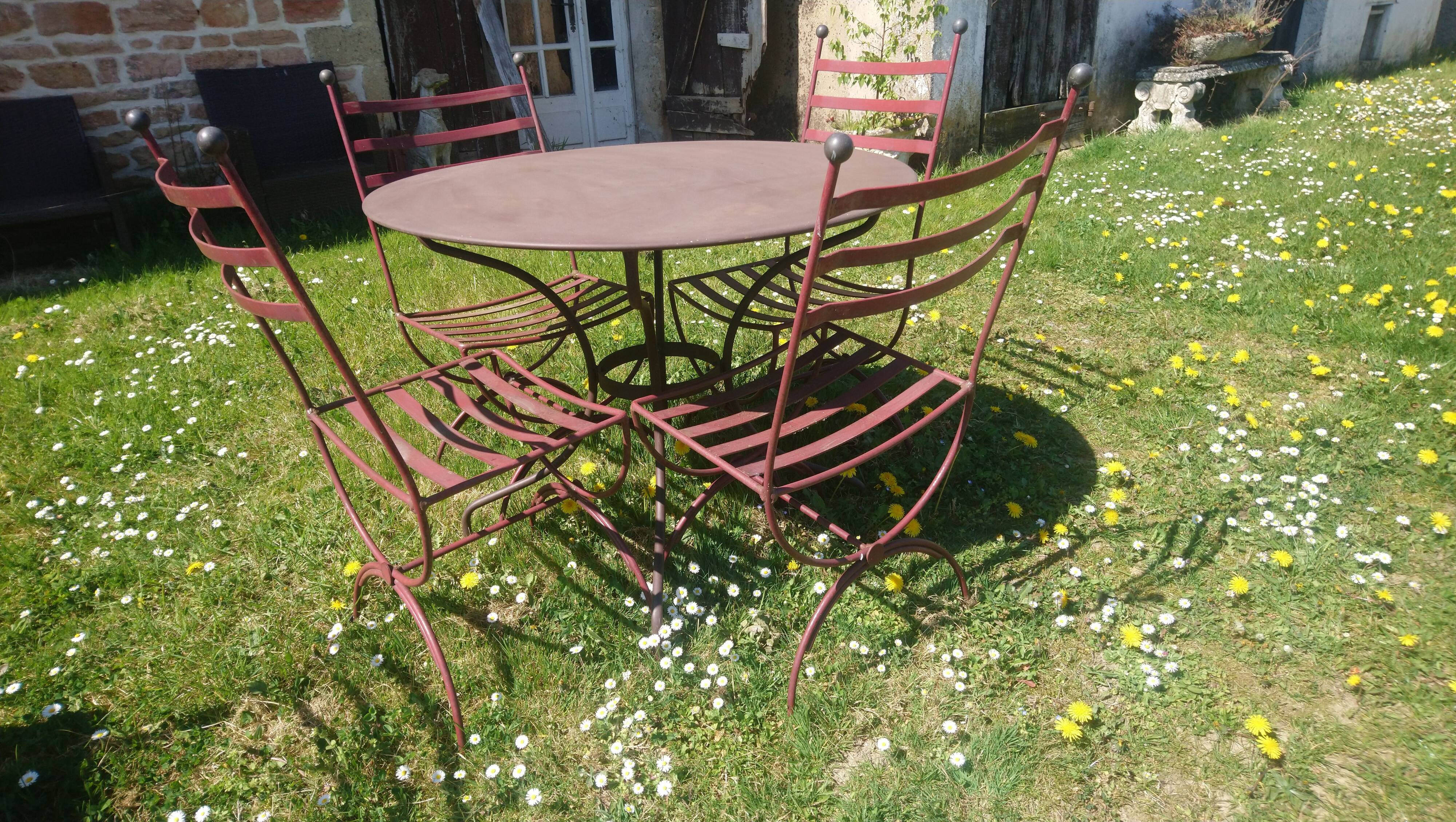 Garden table + 4 wrought iron chairs