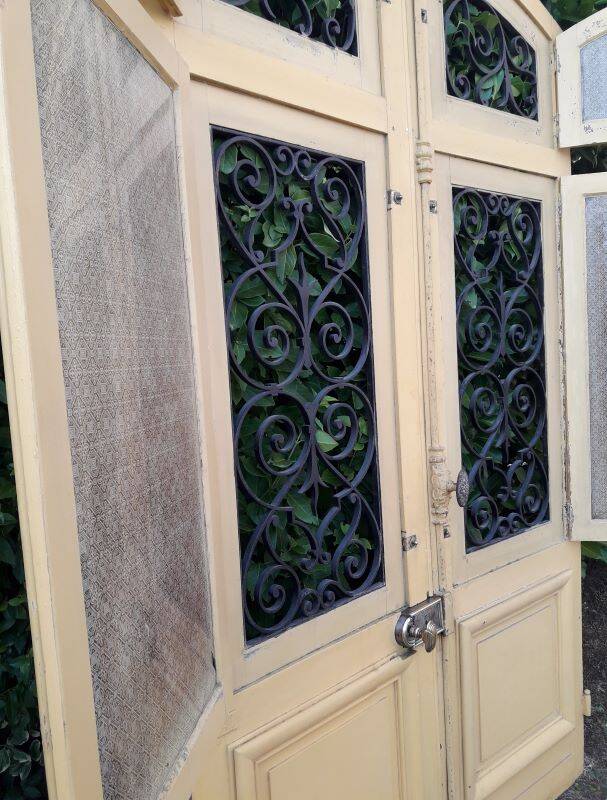 19th century double arched entrance door in oak with grilles and old glass