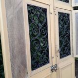 Porte d'entrée cintrée double en chêne, grilles et verre, XIXème