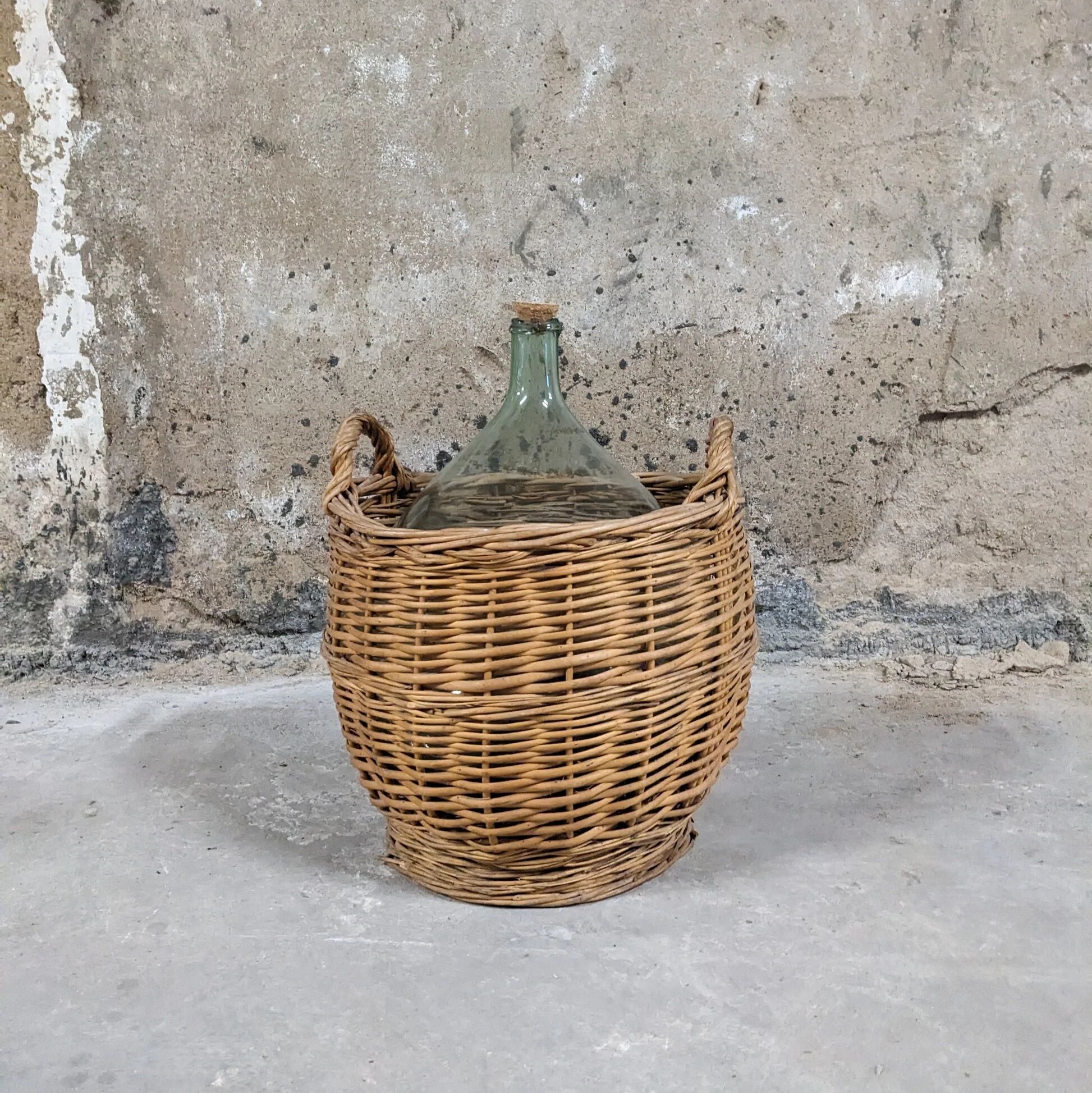 Demijohn in its wicker basket