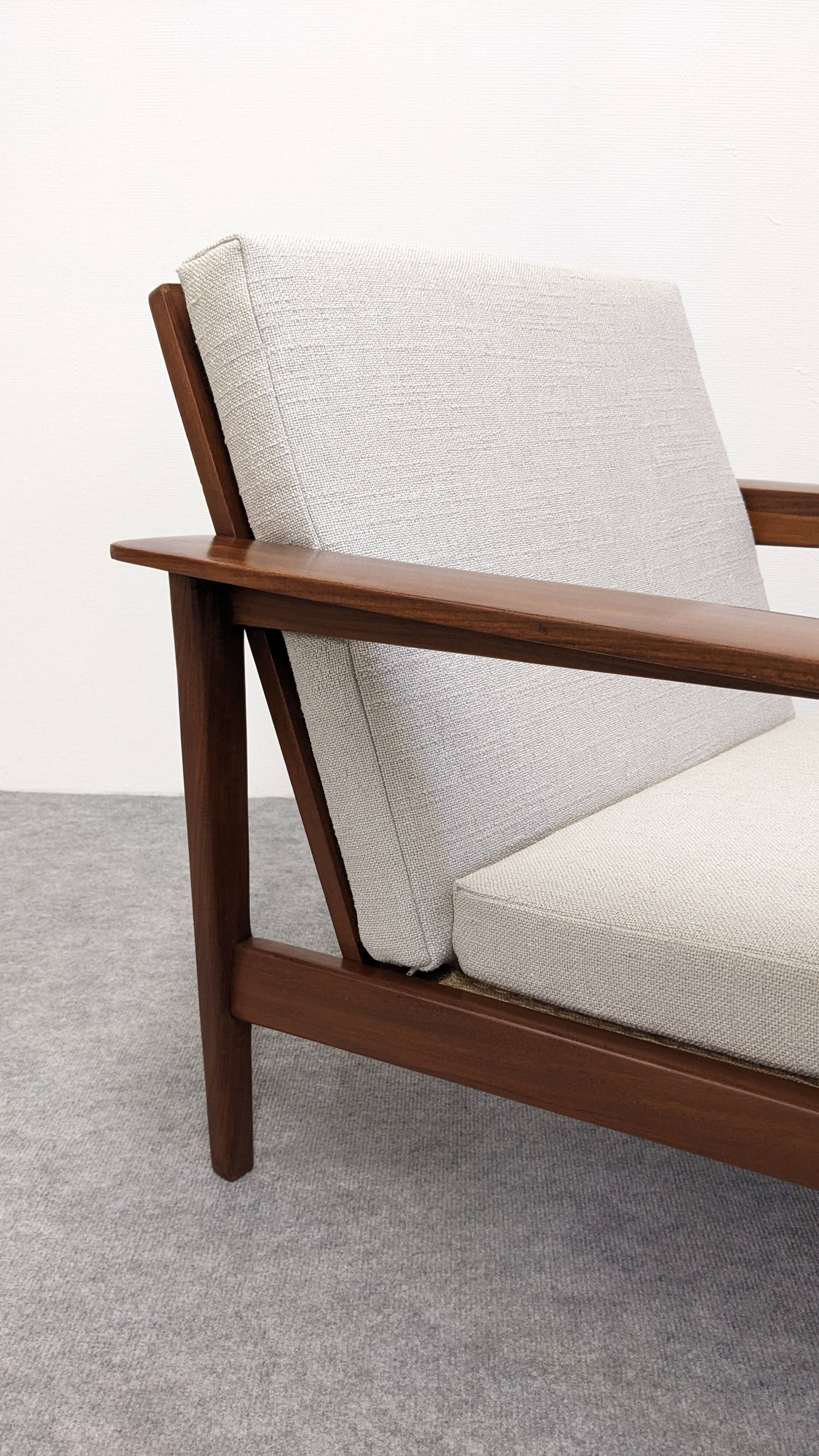 Pair of Scandinavian style armchairs in teak, France circa 1950.