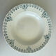 A deep plate in blue and green ironstone, antique French earthenware.