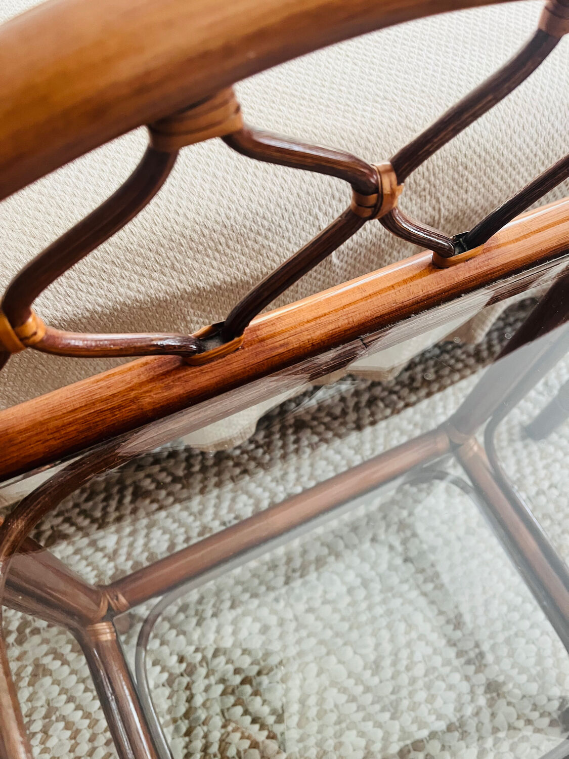 Two rattan and glass bedside tables