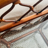 Two rattan and glass bedside tables
