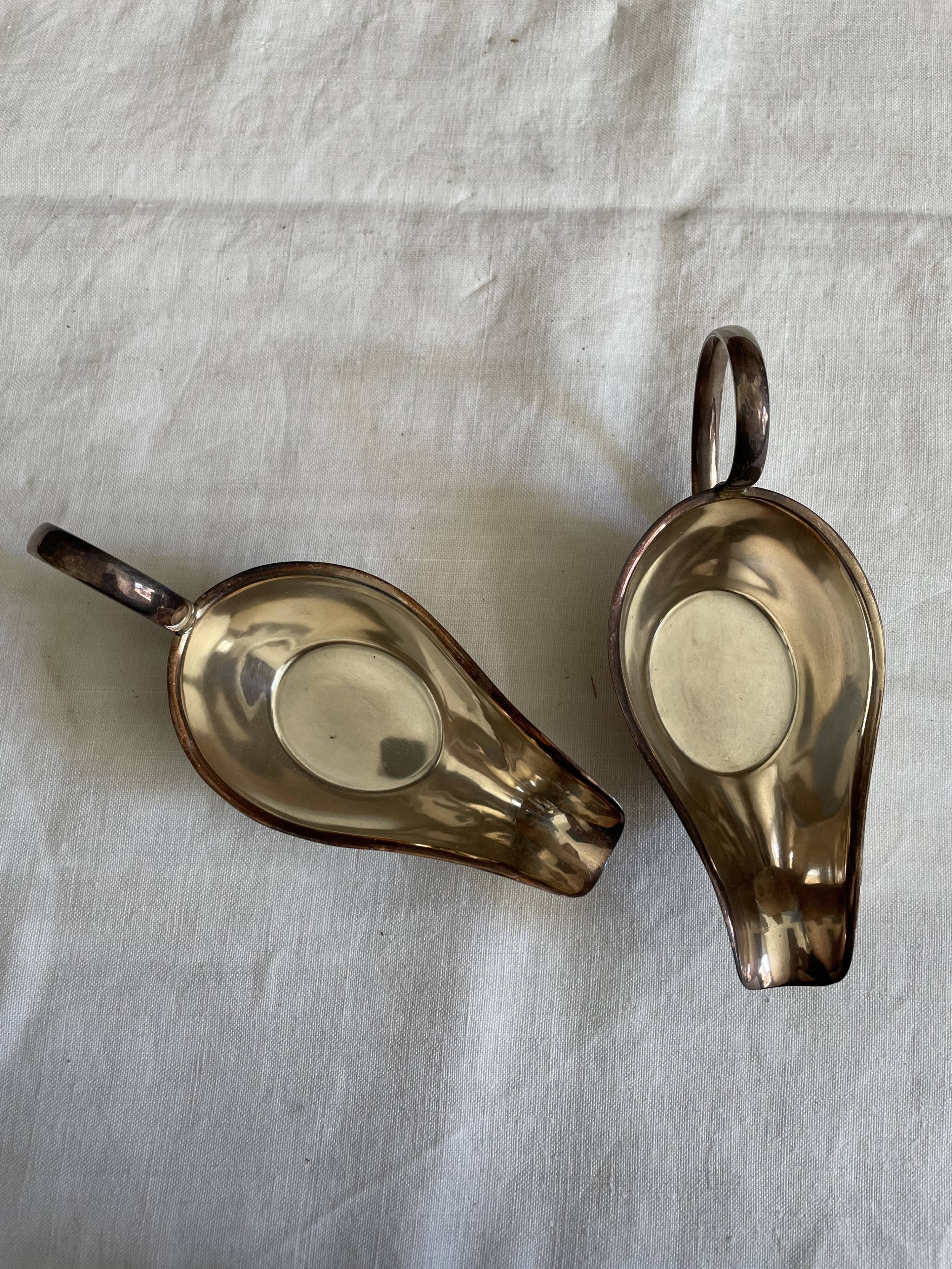 Set of two silver metal saucepans